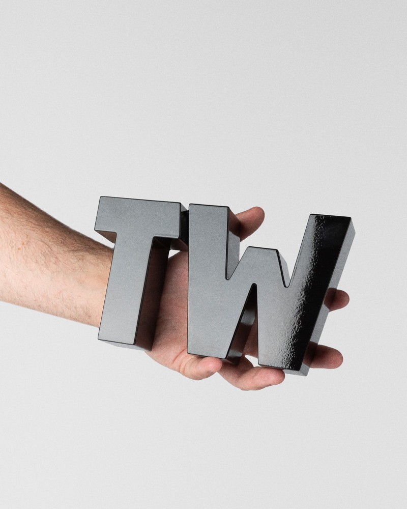 Trophée TextilWirtschaft Forum 2026 TW typographique noir